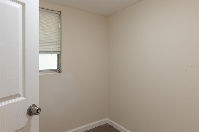 empty room featuring dark wood-type flooring