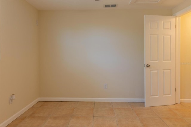 unfurnished room with light tile patterned floors