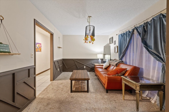 carpeted living room with a textured ceiling