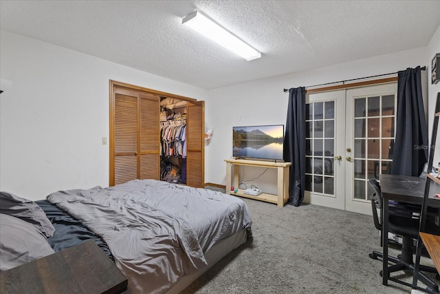 bedroom with carpet flooring, french doors, a textured ceiling, and a closet