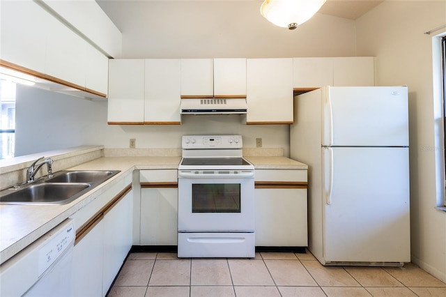 kitchen with white appliances, white cabinets, light tile patterned floors, and sink