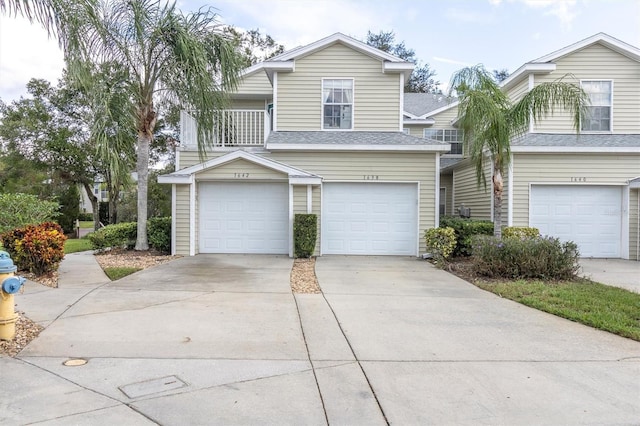 view of front of house featuring a balcony and a garage