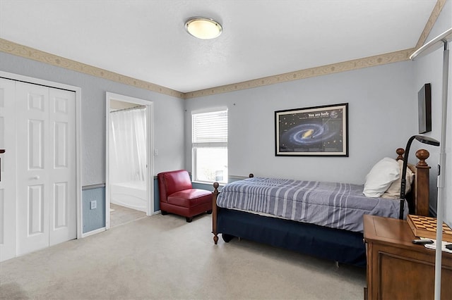 bedroom featuring light colored carpet