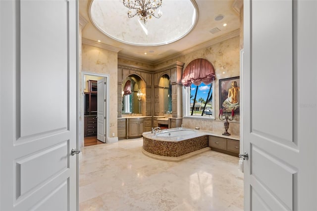 bathroom with a washtub, a chandelier, vanity, and ornamental molding