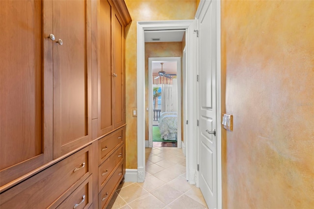101 12th St E, Tierra Verde, FL 33715 - corridor featuring light tile patterned floors and baseboards