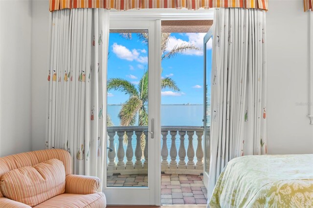 101 12th St E, Tierra Verde, FL 33715 - bedroom featuring access to exterior and a water view