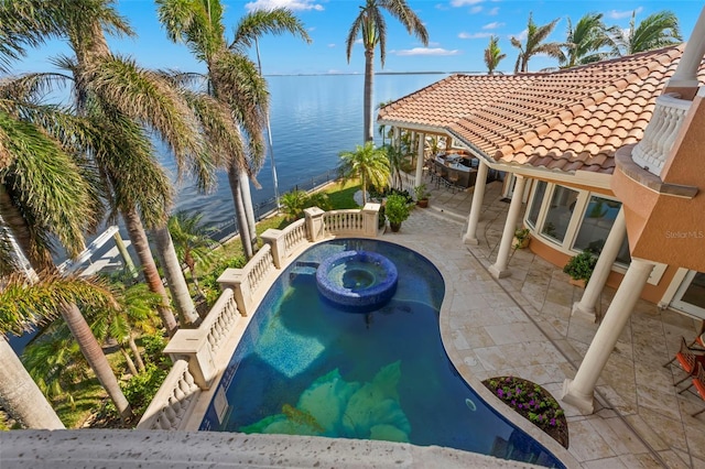 101 12th St E, Tierra Verde, FL 33715 - view of swimming pool with a jacuzzi, a water view, and a patio