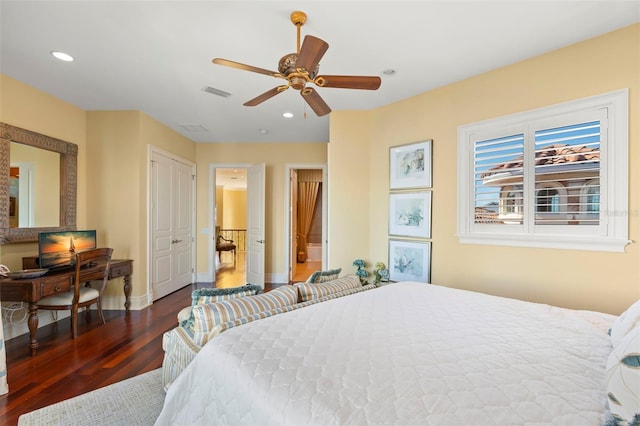 bedroom with ceiling fan and dark hardwood / wood-style flooring