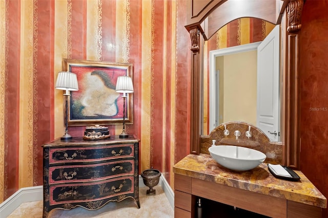 101 12th St E, Tierra Verde, FL 33715 - bathroom featuring vanity and baseboards