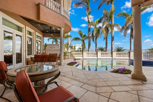 101 12th St E, Tierra Verde, FL 33715 - view of swimming pool with a patio, ceiling fan, french doors, and outdoor dining space