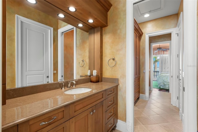 101 12th St E, Tierra Verde, FL 33715 - bathroom featuring tile patterned floors, vanity, baseboards, and recessed lighting