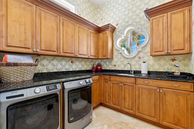 101 12th St E, Tierra Verde, FL 33715 - kitchen with wallpapered walls, a sink, washer and dryer, and brown cabinets