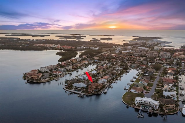 aerial view at dusk with a water view