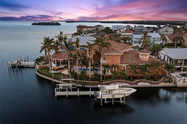 aerial view at dusk with a water view