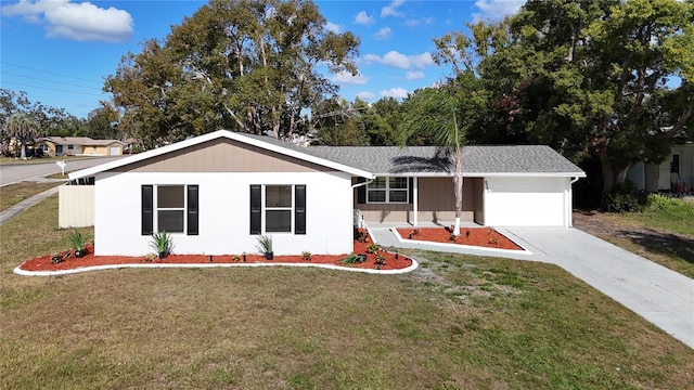 ranch-style home with a garage and a front lawn