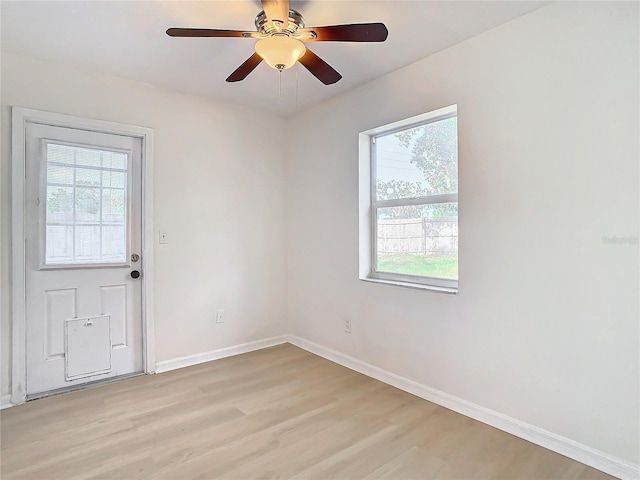 spare room featuring ceiling fan and light hardwood / wood-style floors