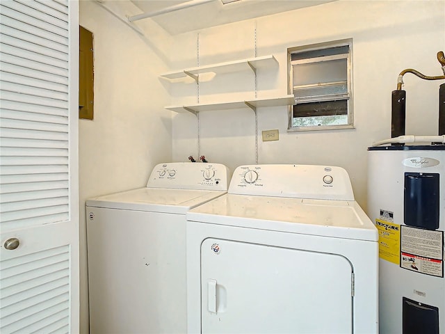 laundry area with washing machine and dryer and water heater