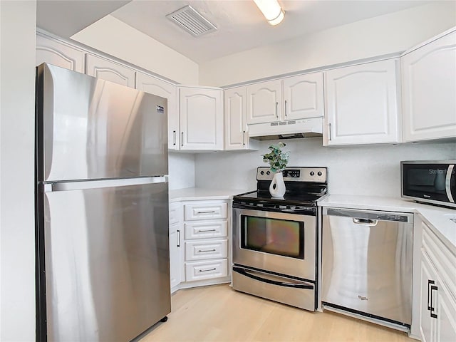 kitchen featuring white cabinetry, light hardwood / wood-style flooring, and appliances with stainless steel finishes