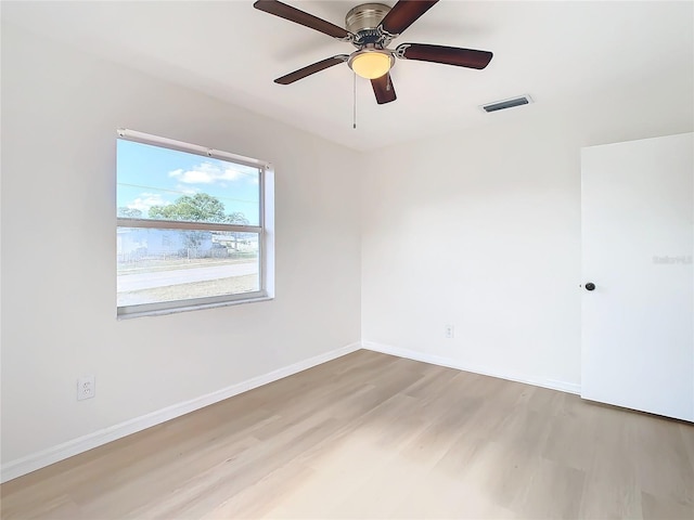 spare room featuring ceiling fan and light hardwood / wood-style flooring