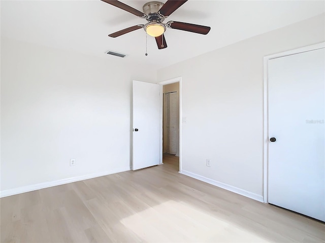 unfurnished bedroom with light hardwood / wood-style floors and ceiling fan