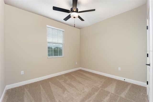 empty room featuring carpet and ceiling fan