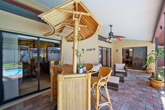 view of patio featuring ceiling fan