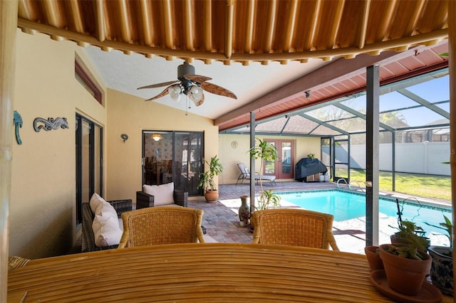 view of swimming pool featuring ceiling fan