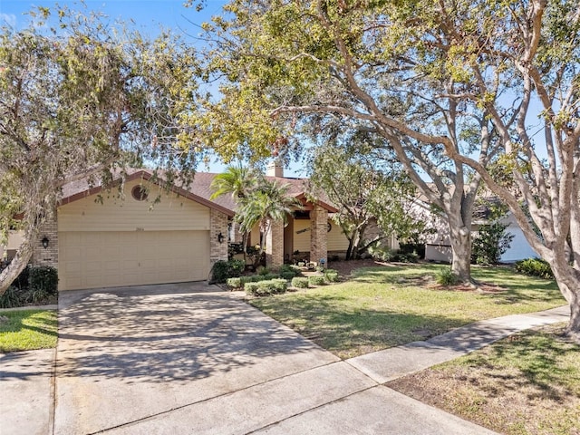 view of front of home featuring a front lawn and a garage