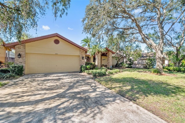 ranch-style house with a front yard and a garage