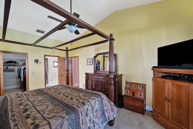 bedroom with a walk in closet, ceiling fan, and lofted ceiling