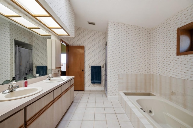 bathroom with vanity, shower with separate bathtub, vaulted ceiling, and tile patterned floors