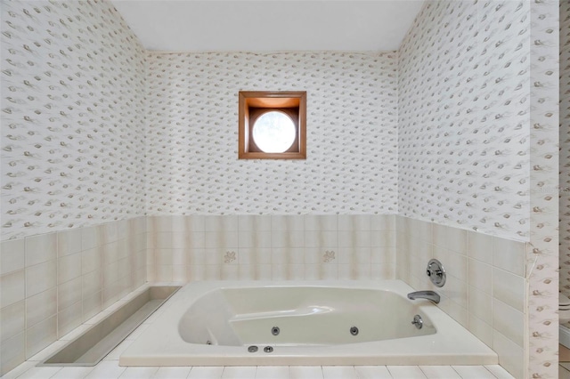 bathroom with tiled bath