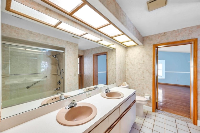 full bathroom with tile patterned flooring, vanity, toilet, and tiled shower / bath