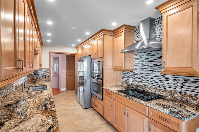 kitchen featuring sink, dark stone countertops, decorative backsplash, stainless steel appliances, and wall chimney exhaust hood