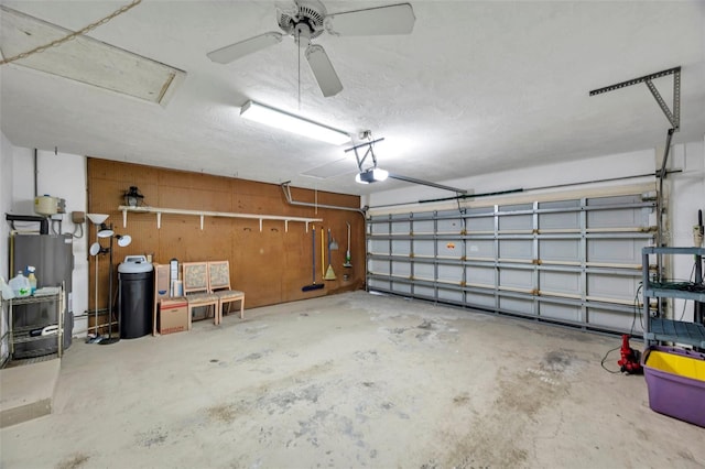 garage with a garage door opener and gas water heater