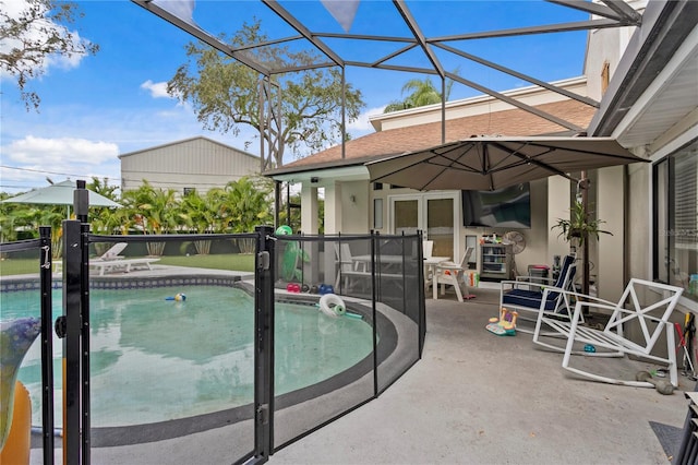 view of pool with a lanai and a patio area