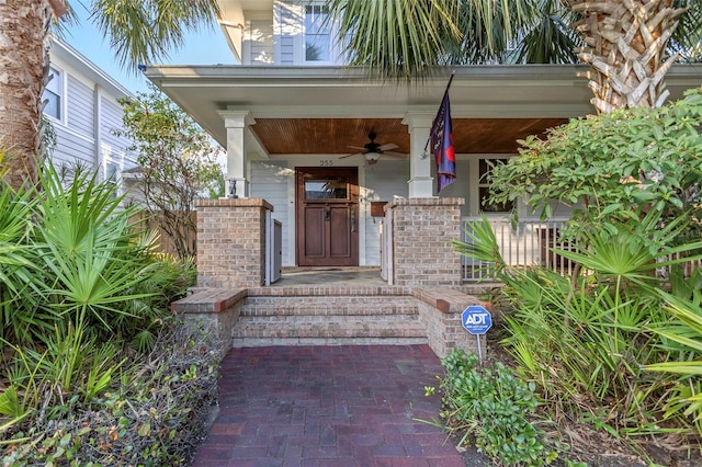 property entrance featuring covered porch and ceiling fan