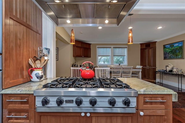 kitchen with light stone counters, decorative light fixtures, stainless steel gas stovetop, crown molding, and island exhaust hood