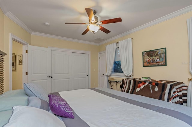 bedroom featuring a closet, ceiling fan, and ornamental molding