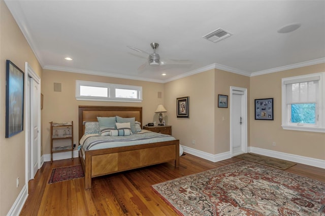 bedroom featuring ceiling fan, dark hardwood / wood-style flooring, and ornamental molding