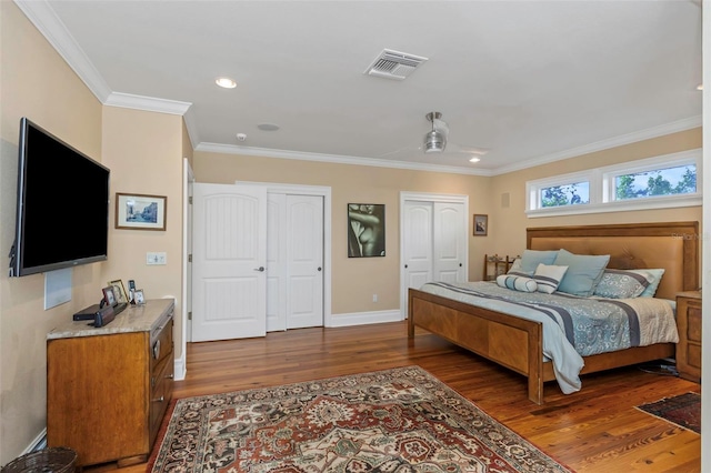 bedroom featuring dark hardwood / wood-style floors and ornamental molding