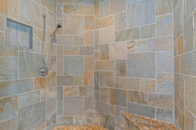 bathroom featuring a tile shower