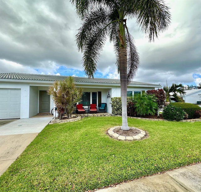 single story home with a garage and a front yard