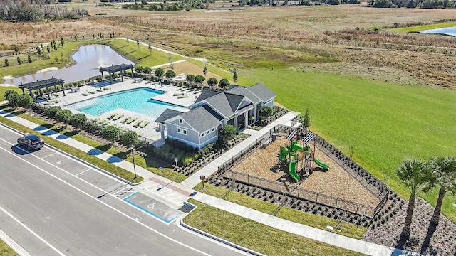 birds eye view of property with a water view