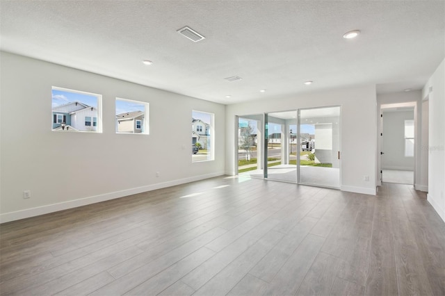 unfurnished room with light hardwood / wood-style flooring