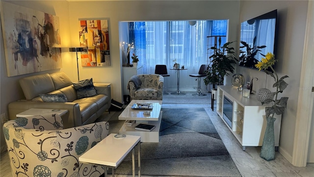 1243 S Martin Luther King Jr Ave Unit B205, Clearwater, FL 33756 - living area featuring baseboards and healthy amount of natural light