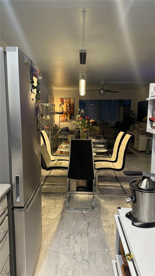 1243 S Martin Luther King Jr Ave Unit B205, Clearwater, FL 33756 - kitchen featuring stainless steel refrigerator with ice dispenser, open floor plan, and marble finish flooring