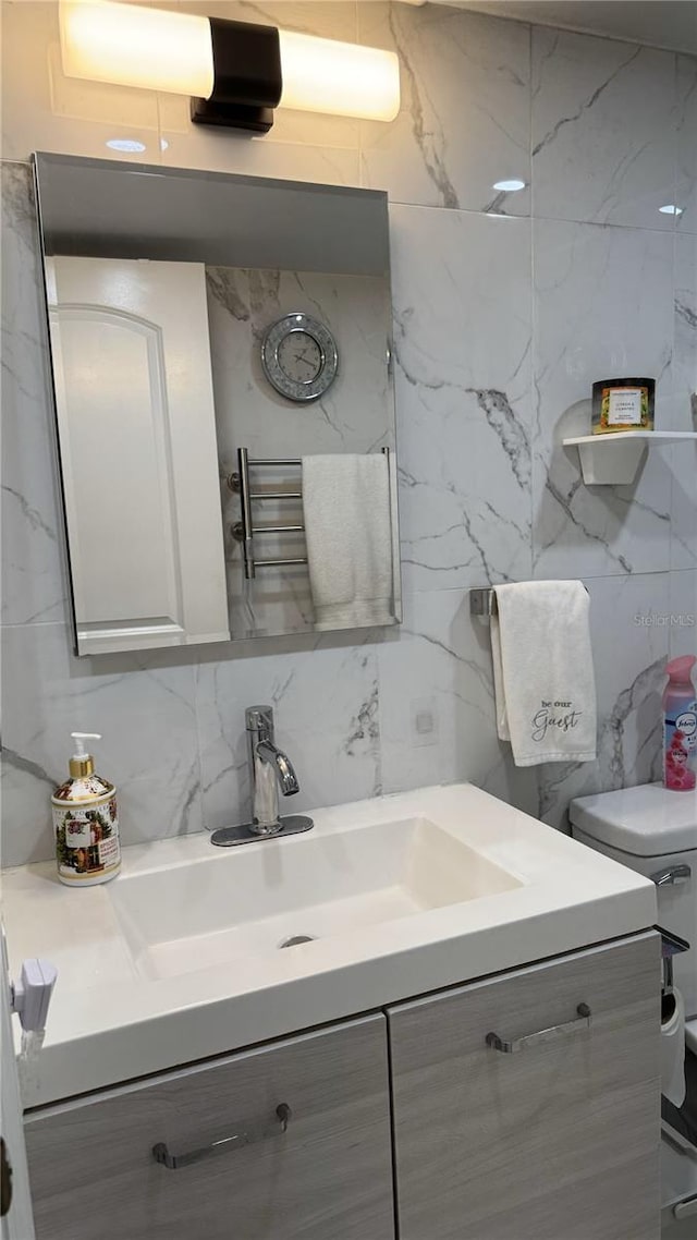 bathroom featuring toilet and vanity