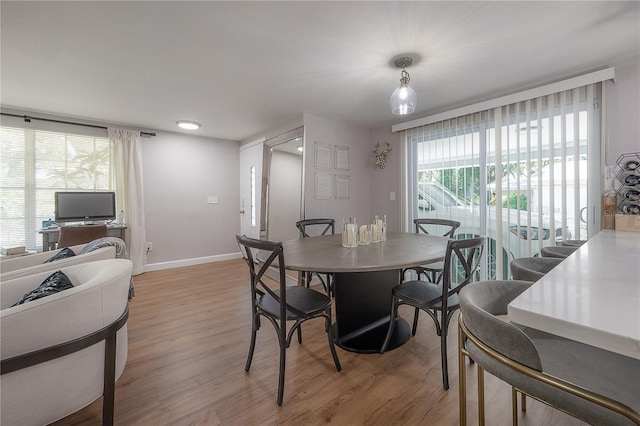 dining space featuring light hardwood / wood-style flooring