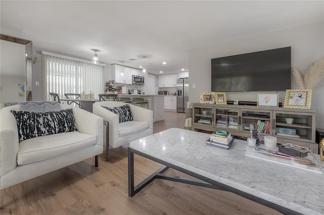 living room with hardwood / wood-style floors